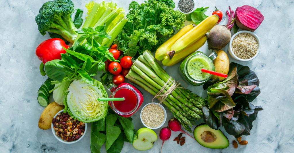 assortment of fresh spring produce beautifully arranged on a white background