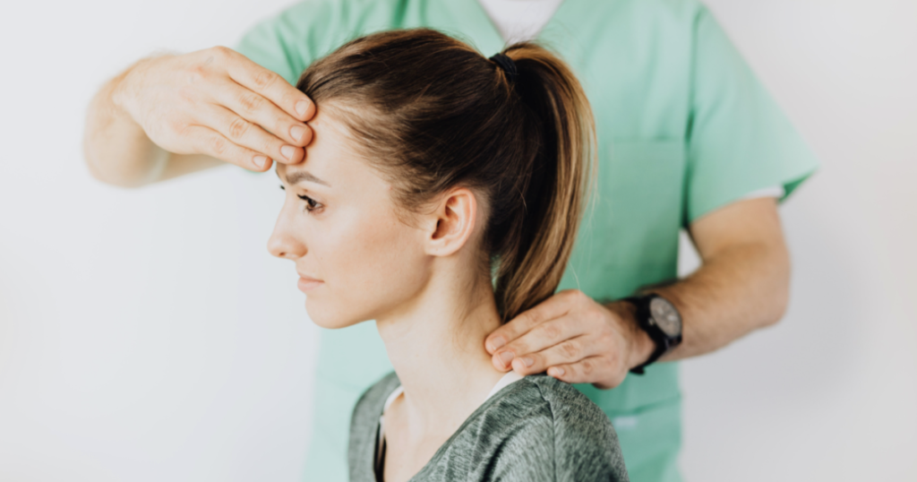 chiropractic adjustment on a woman's neck 