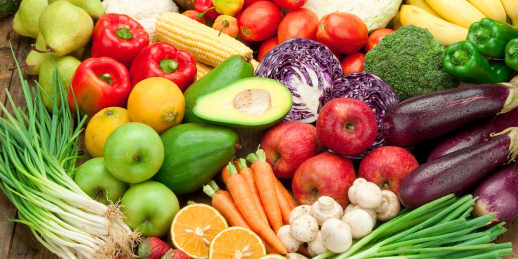 A colorful assortment of fruits and vegetables arranged in a circular pattern.