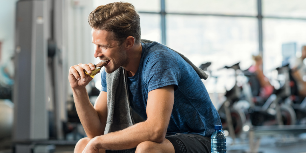 man eating chocolate post-workout