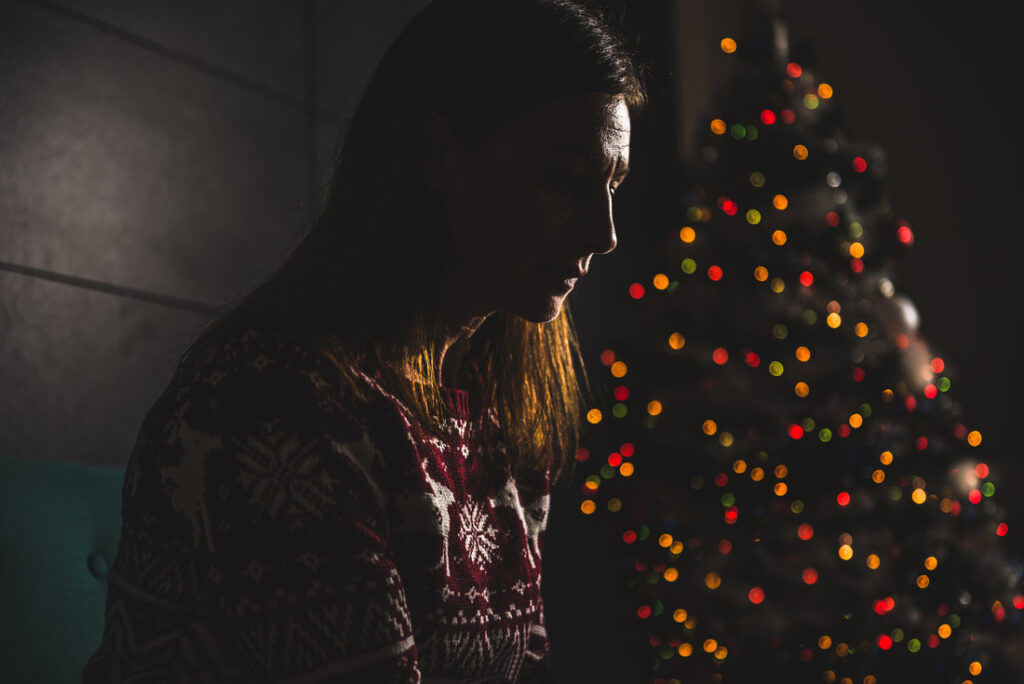lonely women sitting at home during christmas 868903884 2123x1417 orig
